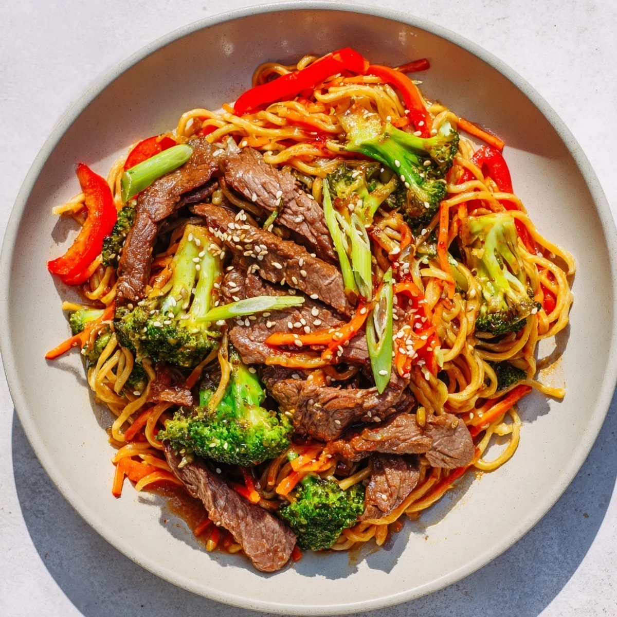 Sizzling Easy Beef Stir-Fry with Lo Mein Noodles, featuring tender beef and colorful vegetables in a rich sauce.
