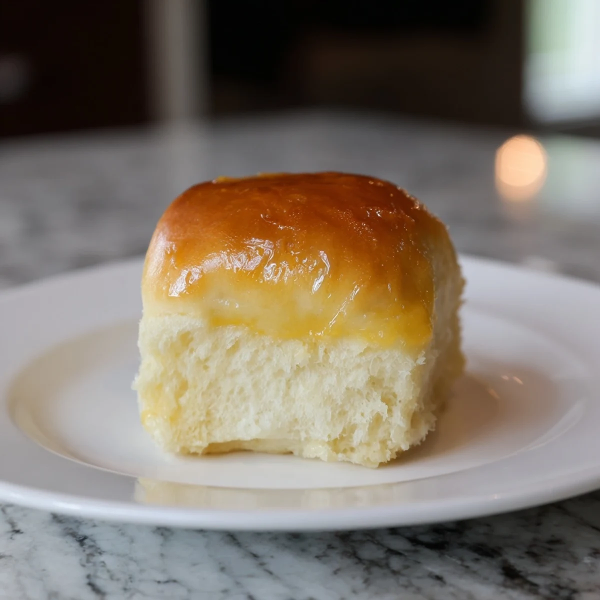 Golden-brown Quick-Rise Dinner Rolls, fresh from the oven, perfect for sopping up gravy.
