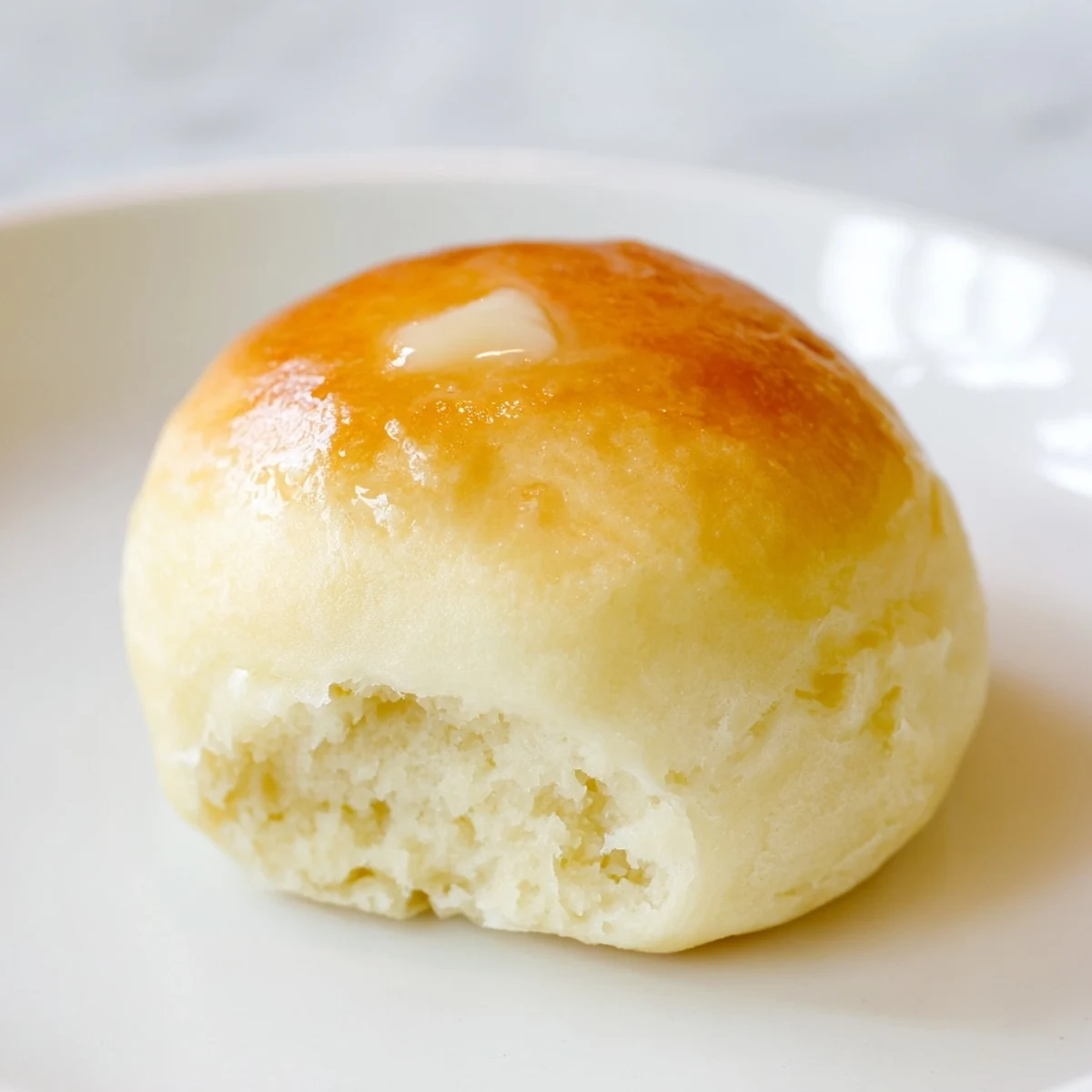 Fluffy and warm Quick-Rise Dinner Rolls, boasting a buttery golden crust you'll love.