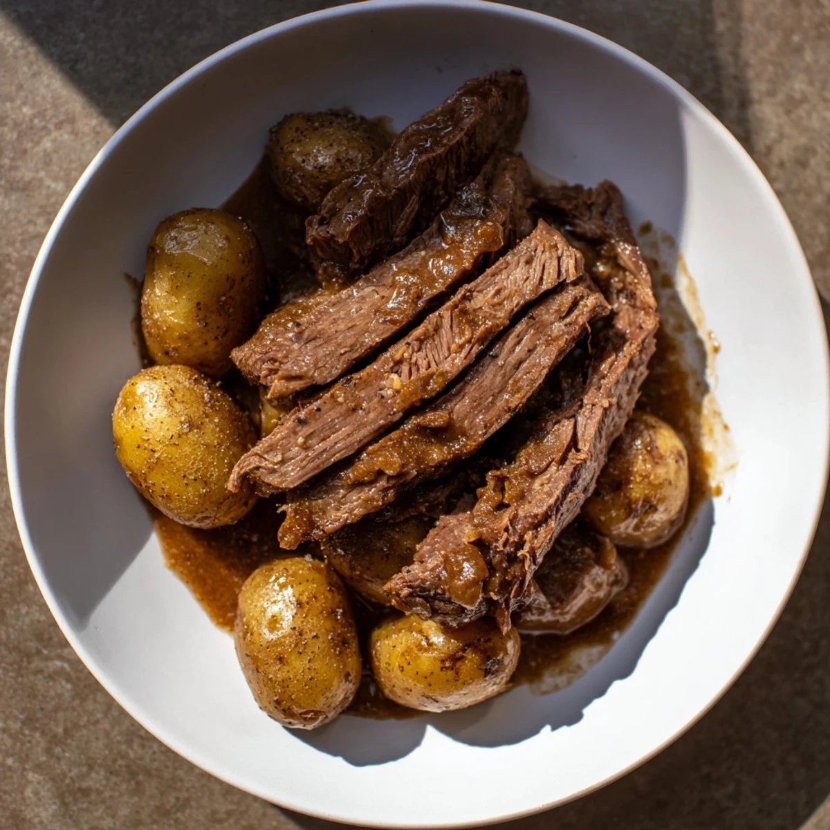 Fork-tender Simple 4-Ingredient Slow Cooker Pot Roast, smelling richly savory.