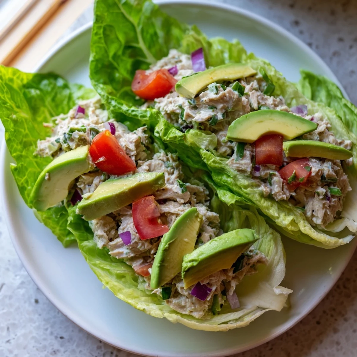 Enjoy this simple Quick & Healthy Tuna Salad Lettuce Wraps recipe: protein-packed tuna with a lemon-herb flavor.