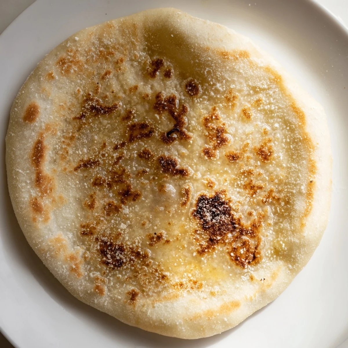 Golden-brown Three-Ingredient Easy Flatbreads, ready for serving with dips and spreads on a rustic wooden board.