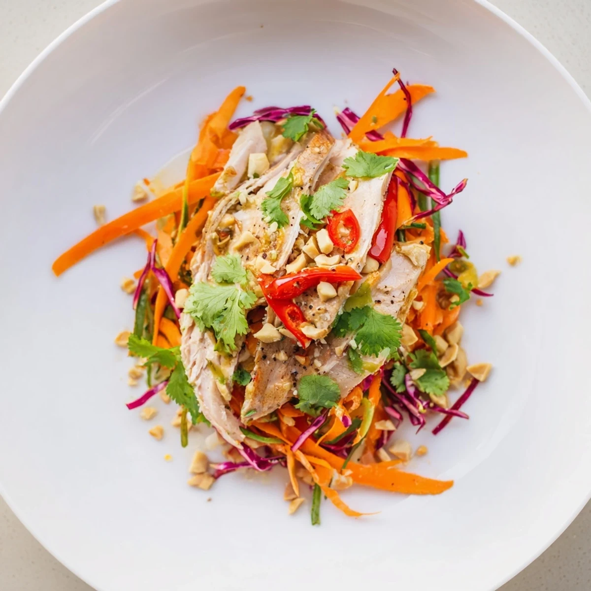 Imagine this: a bowl of crunchy Carrot Ribbon and Chicken Slaw, ready for a flavorful bite.