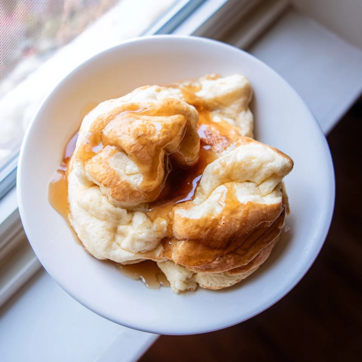 Freshly made fluffy scrambled pancakes, featuring soft, golden curds, perfect for a satisfying, easy breakfast.