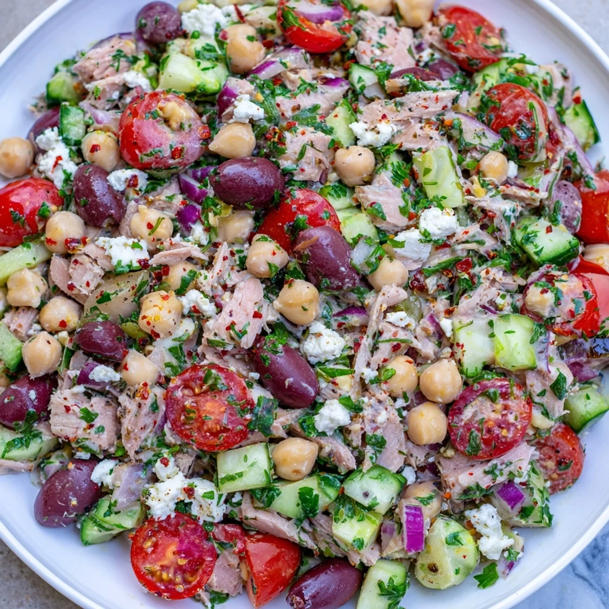 Vibrant Tuna Chickpea Salad bowl with fresh tomatoes, perfect for a quick and healthy lunch.