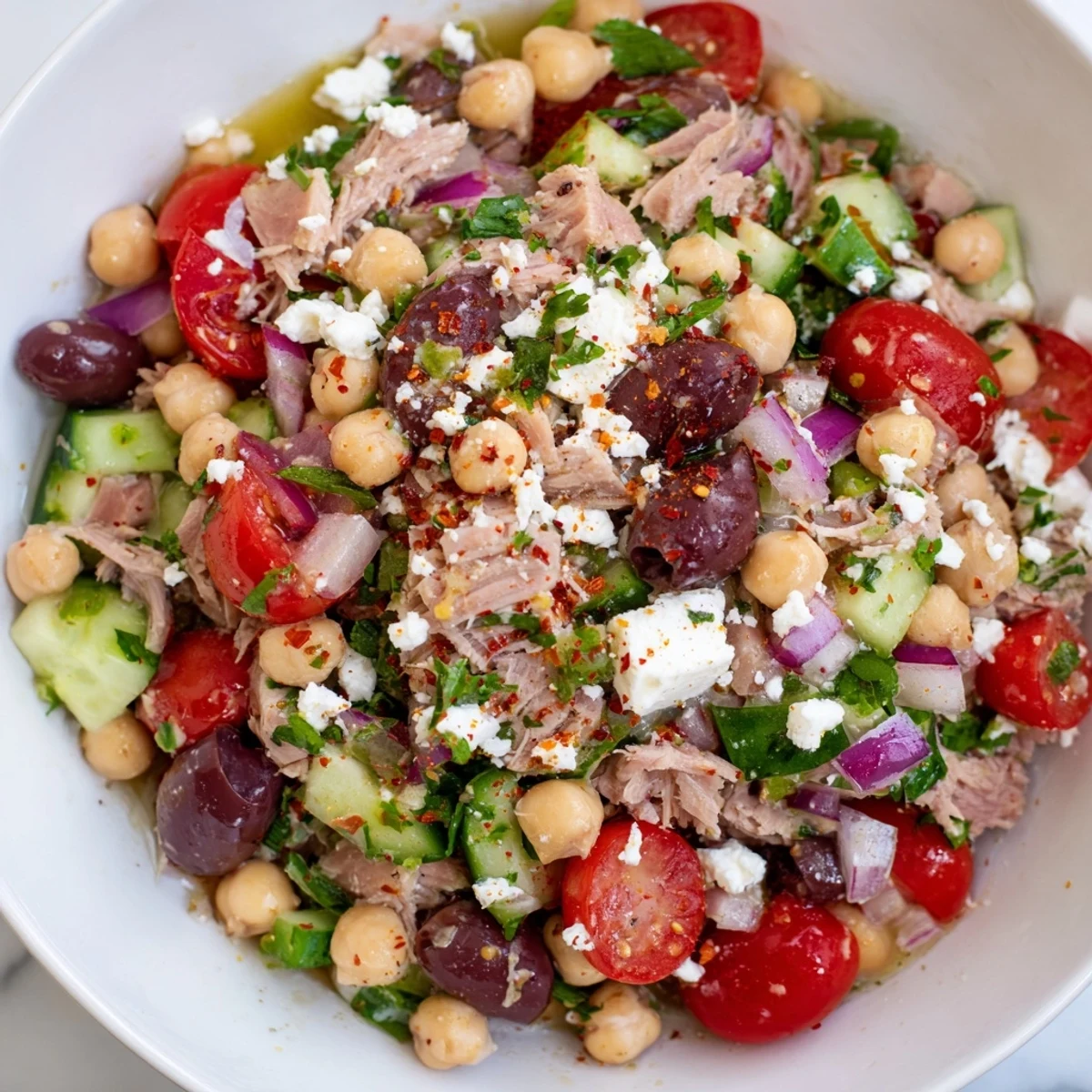Freshly tossed Tuna Chickpea Salad, a light and refreshing meal, ready to serve with lemon dressing.