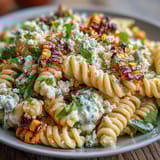 Vibrant Elote Corn Pasta Salad with Cotija, lime, and smoky paprika dressing, perfect for summer gatherings.