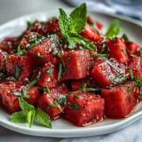 Refreshing watermelon chili lime salad with mint, ready to enjoy.