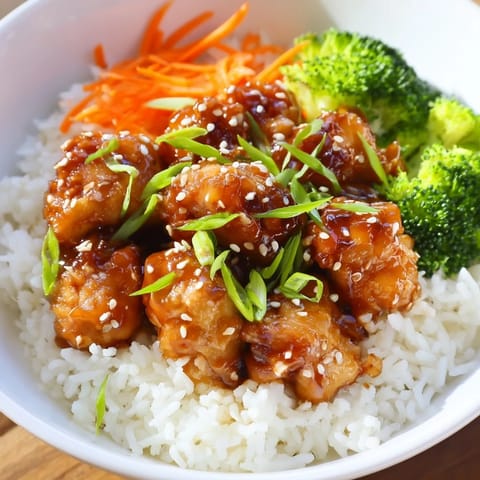 Flavorful Easy 20-Minute Chicken Teriyaki Bowls: a quick, delicious dinner with glistening teriyaki sauce coating steaming rice.
