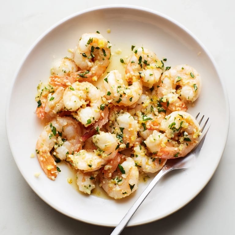 Fragrant 15-Minute Garlic Shrimp Scampi with bright lemon zest, served over golden pasta.