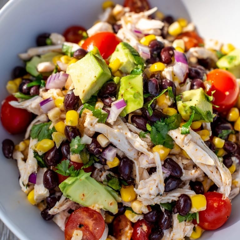 Appetizing shot of homemade Dense Southwestern Bean Salad, ready to serve with tortilla chips.