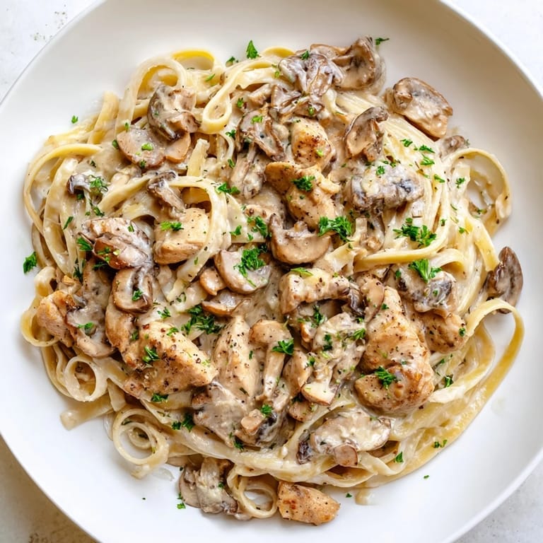 Imagine the aroma! This creamy mushroom chicken pasta showcases a comforting Italian-American dinner, ready to enjoy.