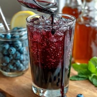 Festive DIY Lemonade Bar with colorful syrups is a perfect summer party drink.